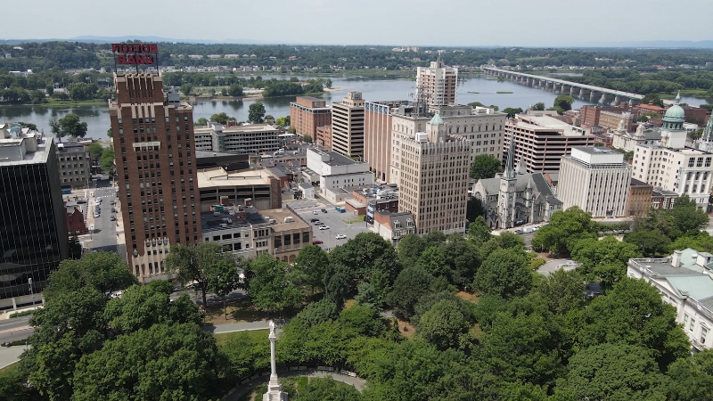 Aerial view of Harrisburg with its cityscape, river, and green spaces
