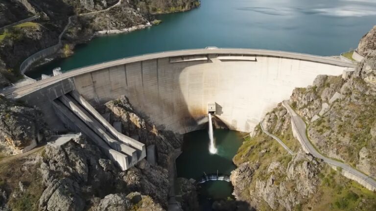An Aerial View of A Dam Showcasing Responsible Dam Construction and Its Integration with The Surrounding Landscape