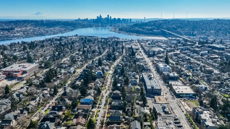 Aerial view of Seattle with its residential neighborhoods, waterways, and skyline