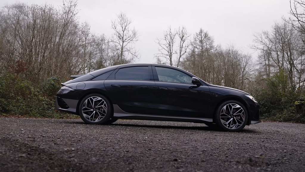 A sleek black Hyundai Ioniq 6 parked on a rural road, offering a stylish and efficient option among modern long-term vehicles