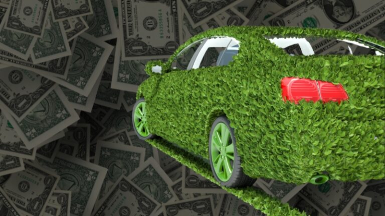A green car made of leaves drives over dollar bills, symbolizing ways to finance an eco-friendly vehicle