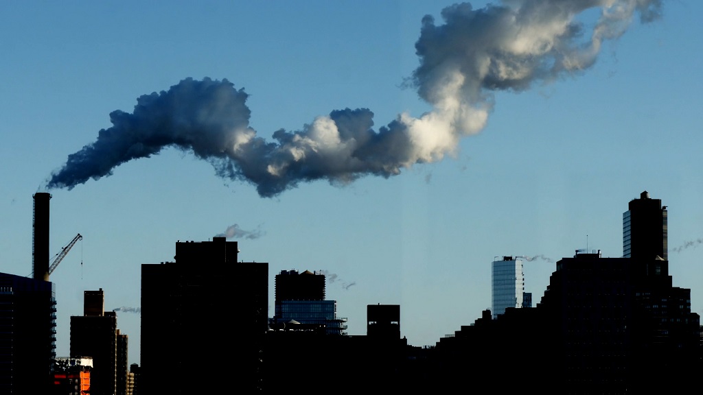 Smoke from city factory highlighting urgent climate awareness needs