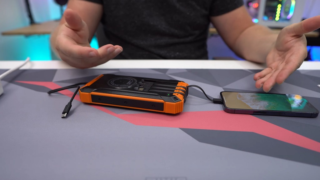 cable-connected solar phone charger in use on a desktop