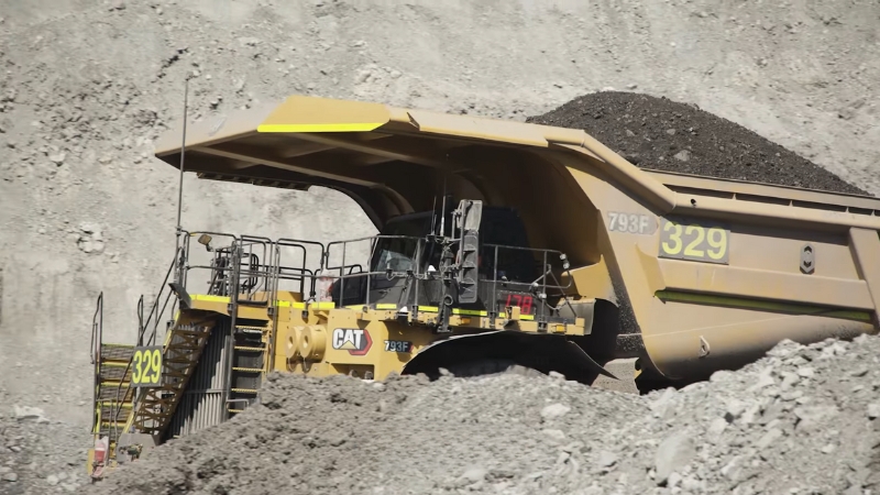 Large Caterpillar dump truck moving earth, showing remanufacturing in the circular economy