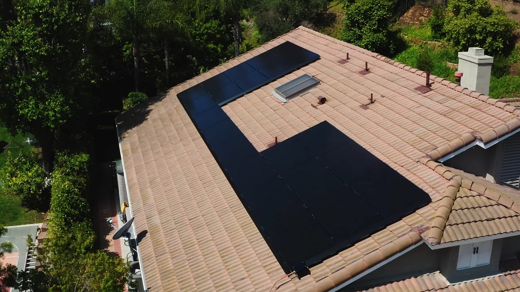 Rooftop solar panel layout with gaps around vents and skylight for obstruction clearance