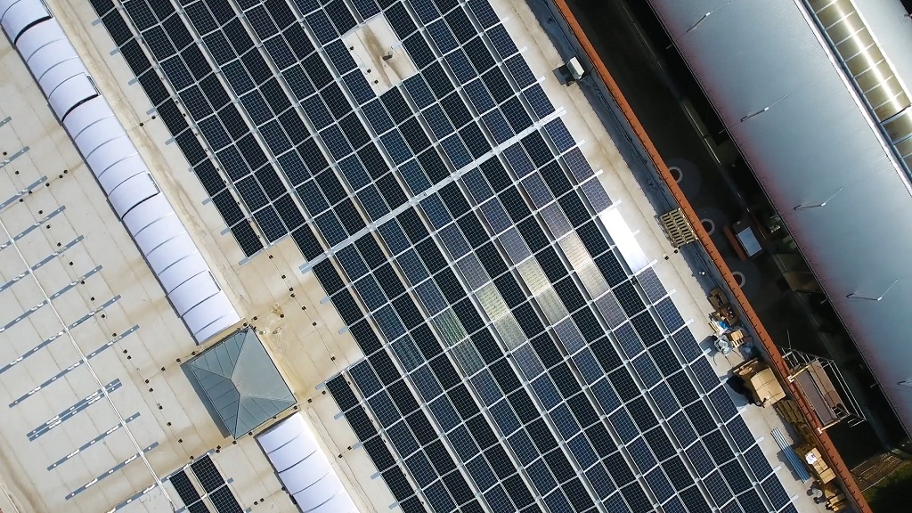 Solar array installation on a large industrial rooftop for compliance and permitting