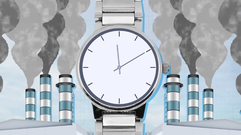 A silver watch appears in front of factories releasing heavy smoke, hinting at hidden pollution behind greenwashing claims