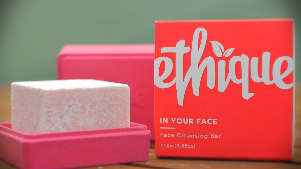 Ethique solid face cleansing bar in pink packaging with modern design