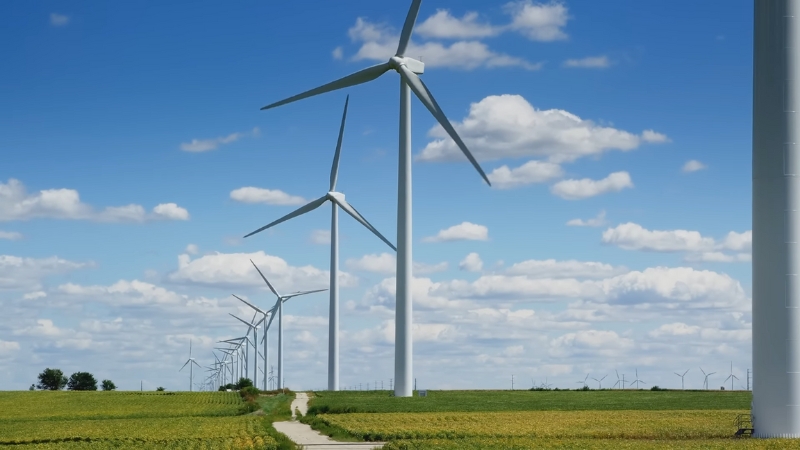 Wind turbines in an open field producing clean renewable wind energy