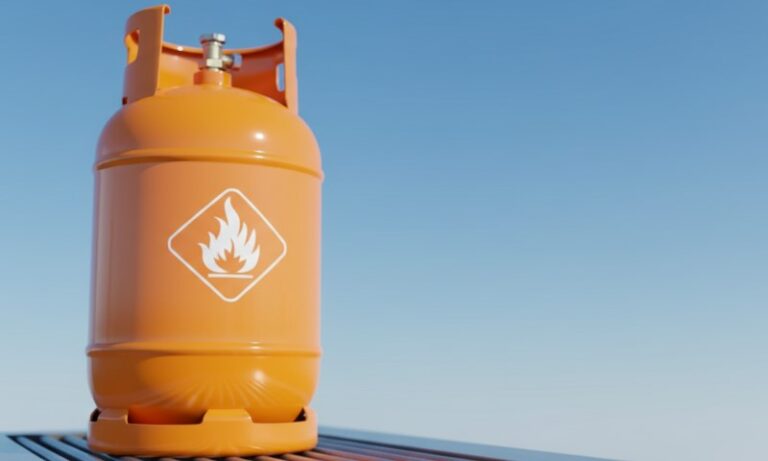 An orange gas cylinder with a flame symbol
