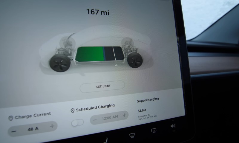 Touchscreen display in a car shows 167 miles range with a battery graphic