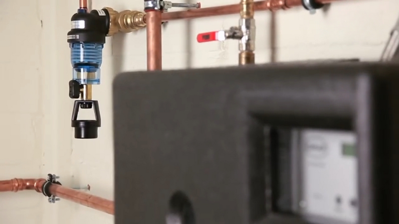 Water filtration unit and plumbing pipes connected to a household rainwater system