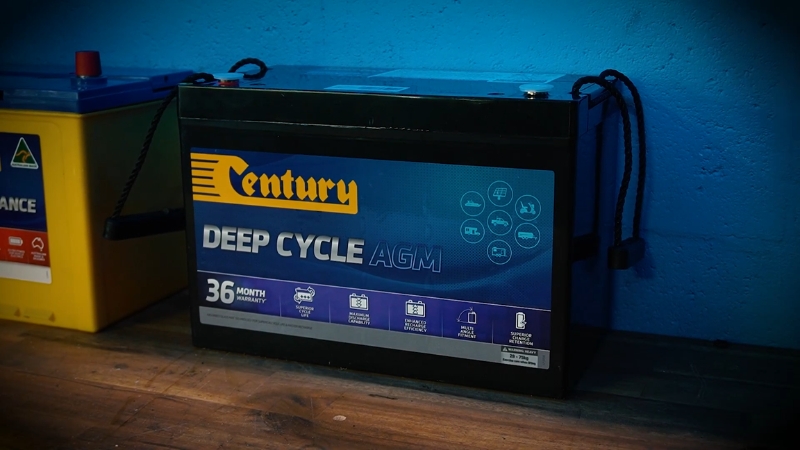 Deep cycle AGM battery placed indoors for maintenance and safety comparison
