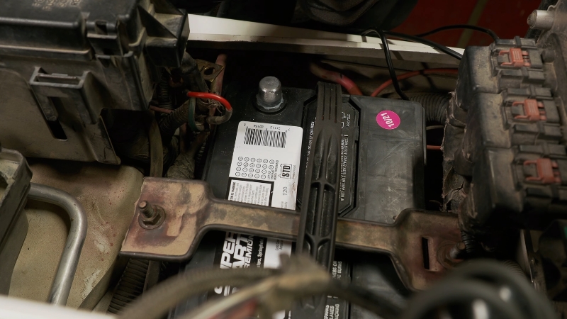Car battery installed in an engine bay during AGM vs gel batteries power delivery comparison