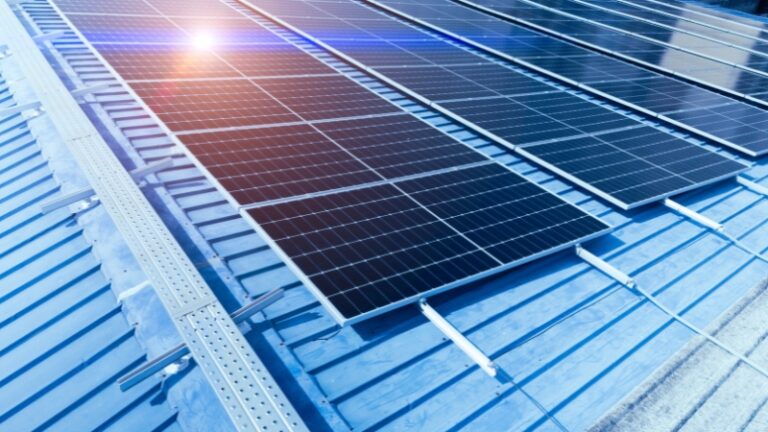 500 watt solar panel installed on a metal rooftop under direct sunlight