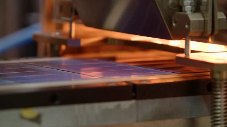 Manufacturing equipment assembling solar cells at one of the top solar panel companies