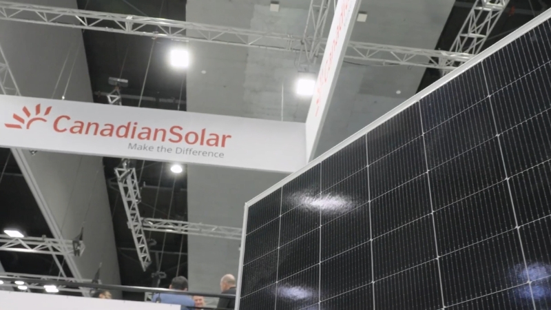 Canadian Solar booth with a solar panel displayed at an industry trade show