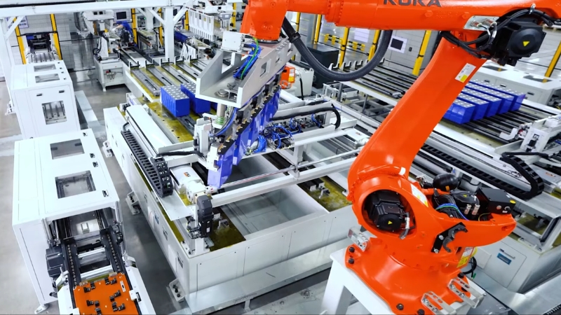 Robotic arms assembling solar panels on an automated factory production line