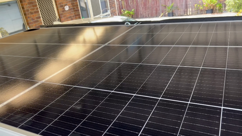 Close-up of a 500 watt solar panel installed outdoors in real-world conditions